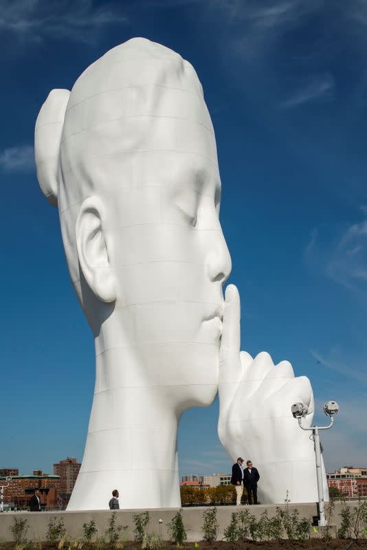 Artist Jaume Plensa stands near his statue "Water's Soul" in Jersey City, New Jersey
