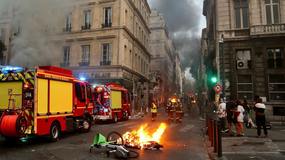 Looting is taking place amid the riots, French authorities say. - Alexis Jumeau/SIPA/AP