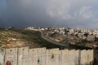 FILE PHOTO: A general view picture shows the Israeli barrier running along the Palestinian town of Abu Dis in the Israeli-occupied West Bank, east of Jerusalem