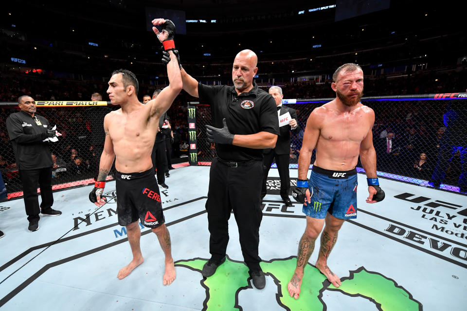 CHICAGO, IL - JUNE 08:  (L-R) Tony Ferguson celebrates his victory over Donald Cerrone in their lightweight bout during the UFC 238 event at the United Center on June 8, 2019 in Chicago, Illinois. (Photo by Jeff Bottari/Zuffa LLC/Zuffa LLC via Getty Images)