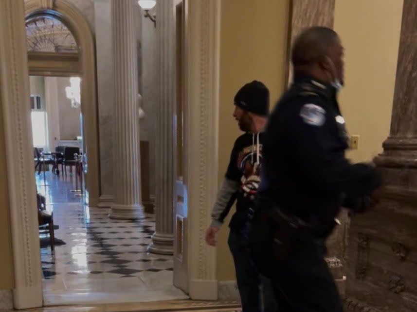 <p>A police officer, identified as Eugene Goodman, has been hailed a hero after distracting a pro-Trump mob from the entrance to the US Senate chambers during Wednesday’s riots</p> (Twitter)