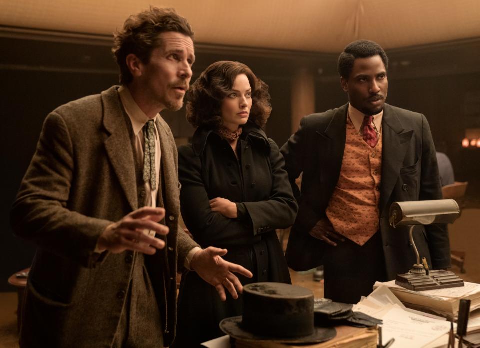 In David O. Russell's period mystery comedy, Valerie (Margot Robbie, center) reunites with her friends, World War I veterans Burt (Christian Bale) and Harold (John David Washington) when they're accused of murder.