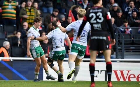 George Furbank of Northampton Saints (L) celebrates scoring his side's fourth try - Credit: GETTY IMAGES