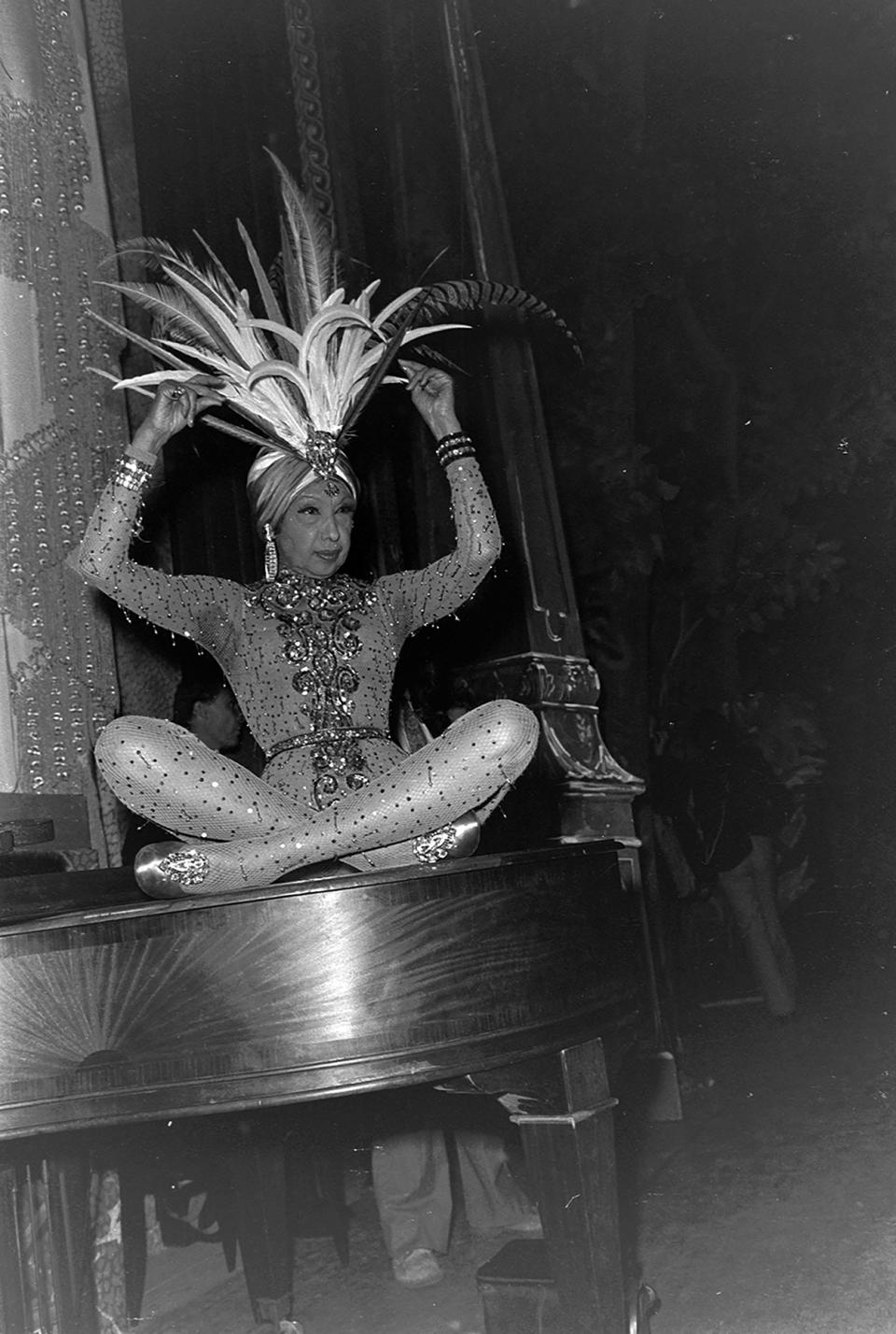 American-born French entertainer Josephine Baker rehearses on stage before her costume performance. 