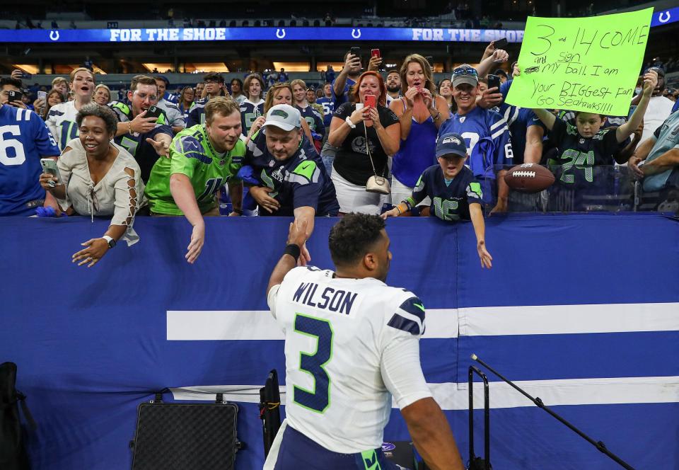 Russell Wilson takes in a win against the Colts in 2021.