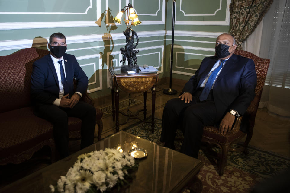 Egyptian Foreign Minister Sameh Shoukry, right, meets with Israeli Foreign Minister Gabi Ashkenazi, at the Tahrir Palace in Cairo, Egypt, Sunday, May 30, 2021. (AP Photo/Nariman El-Mofty)