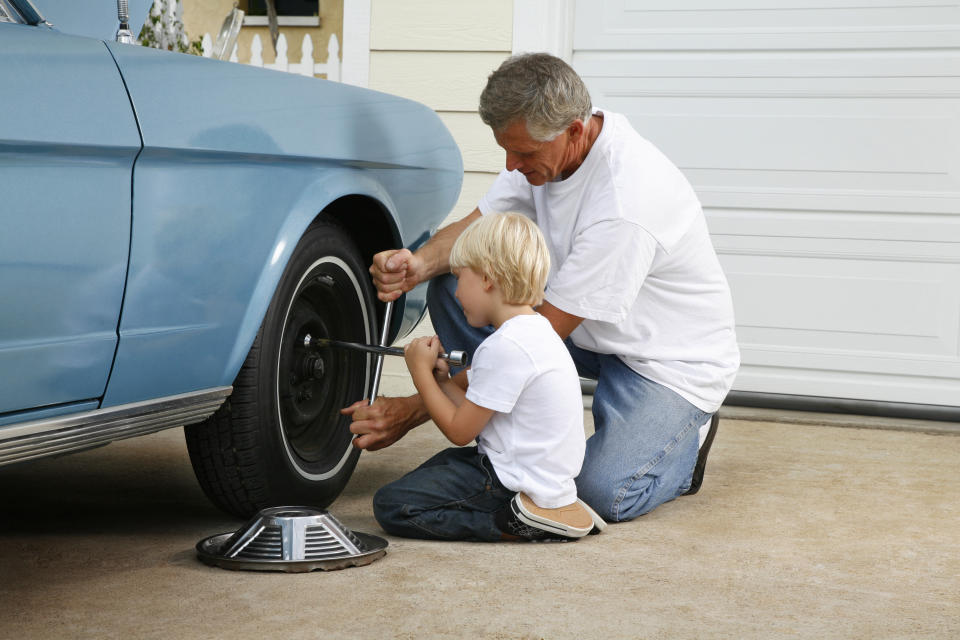 father and son working on the car