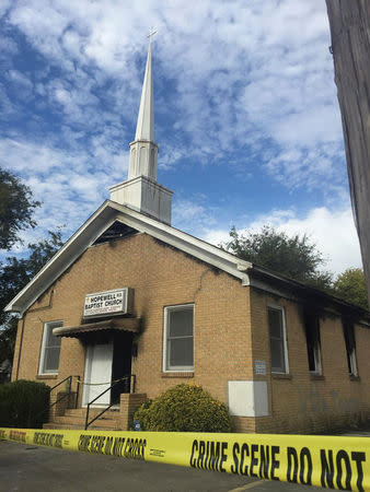 Hopewell Baptist Church is damaged by fire and graffiti in Greenville, Mississippi, U.S., November 2, 2016. Courtesy Angie Quezada/Delta Daily News via REUTERS