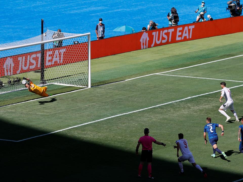 Morata had a first-half penalty saved, the second time Spain failed to convert from the spot in the group stages (Getty Images)