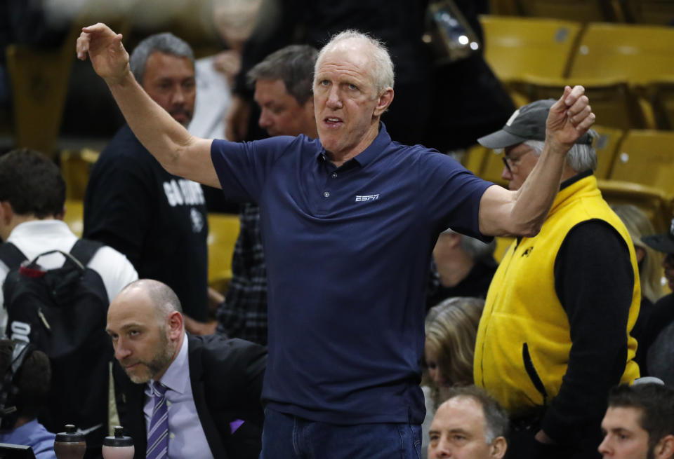 FILE - Television analyst Bill Walton stretches before the first half of an NCAA college basketball game between Oregon and Colorado, Jan. 2, 2020, in Boulder, Colo. Walton, who starred for John Wooden's UCLA Bruins before becoming a Basketball Hall of Famer and one of the biggest stars of basketball broadcasting, died Monday, May 27, 2024, the league announced on behalf of his family. He was 71. (AP Photo/David Zalubowski, File)