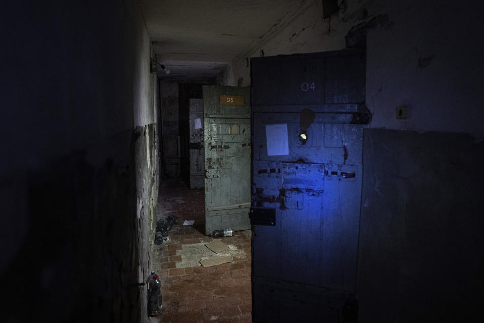 FILE - Holding cells are visible in a basement of a police station that was used by Russian forces to detain and torture Ukrainians in the recently liberated town of Izium, Ukraine, Sept. 22, 2022. Russian torture in Izium was arbitrary, widespread and absolutely routine, extending to both civilians and soldiers throughout the city, an AP investigation has found. (AP Photo/Evgeniy Maloletka, File)