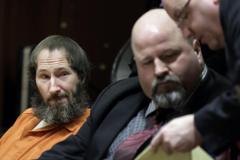 FILE- In this March 8, 2019 file photo, Johnny Bobbitt, left, looks on as his attorney John Keesler and Assistant Prosecutor Andrew McDonnell, right, talk while appearing before Superior Court Judge Christopher Garrenger at the Burlington County Courthouse in Mount Holly, N.J. Bobbitt, who pleaded guilty to taking part in a $400,000 GoFundMe scam with a New Jersey couple, will face sentencing on Friday, April 12. (Elizabeth Robertson/The Philadelphia Inquirer via AP)