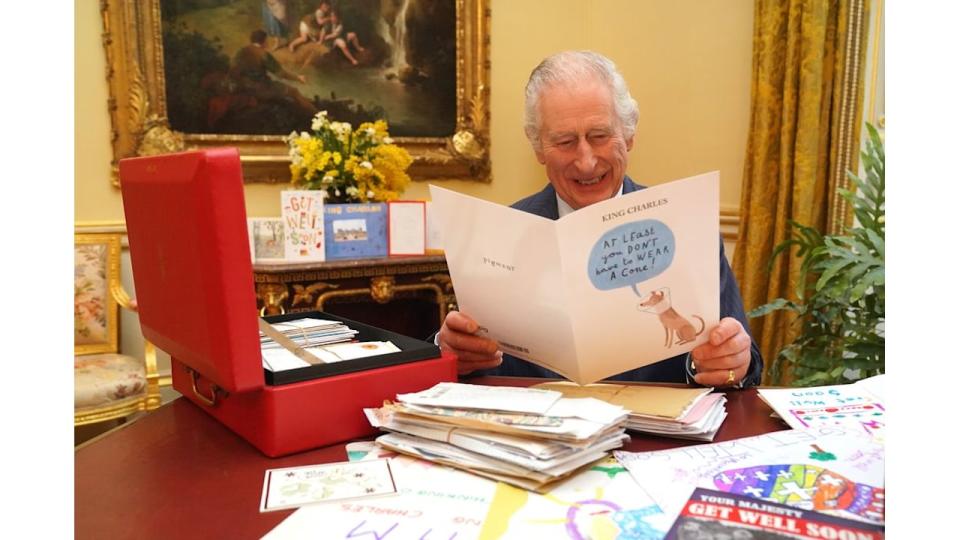 King Charles laughing at get well card