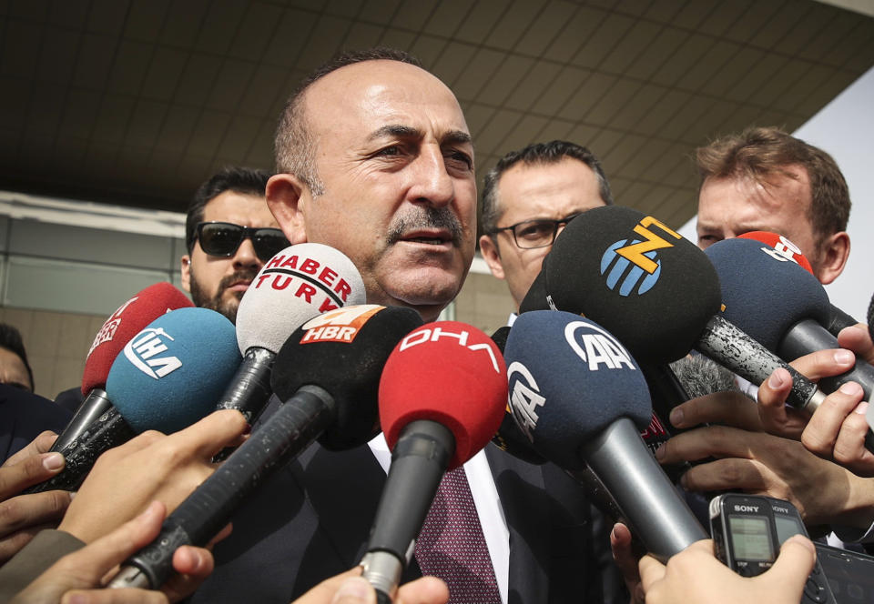 Turkey's Foreign Minister Mevlut Cavusoglu speaks to the media after a meeting with U.S. Secretary of State Mike Pompeo at the Esenboga Airport in Ankara, Turkey, Wednesday, Oct. 17, 2018. Pro-government newspaper Yeni Safak on Wednesday said it had obtained audio recordings of the alleged killing of Saudi writer Jamal Khashoggi inside the Saudi Arabia's consulate in Istanbul on Oct. 2.(Cem Ozdel/Turkish Foreign Ministry via AP, Pool)