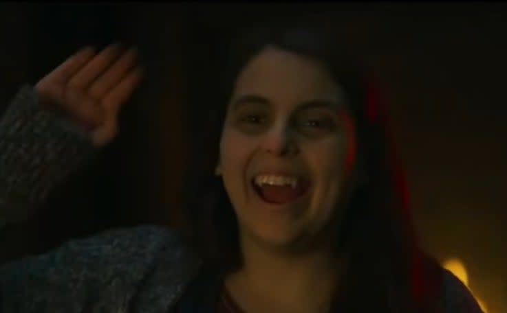 Jenna waving "Hello" in "What We Do In the Shadows"