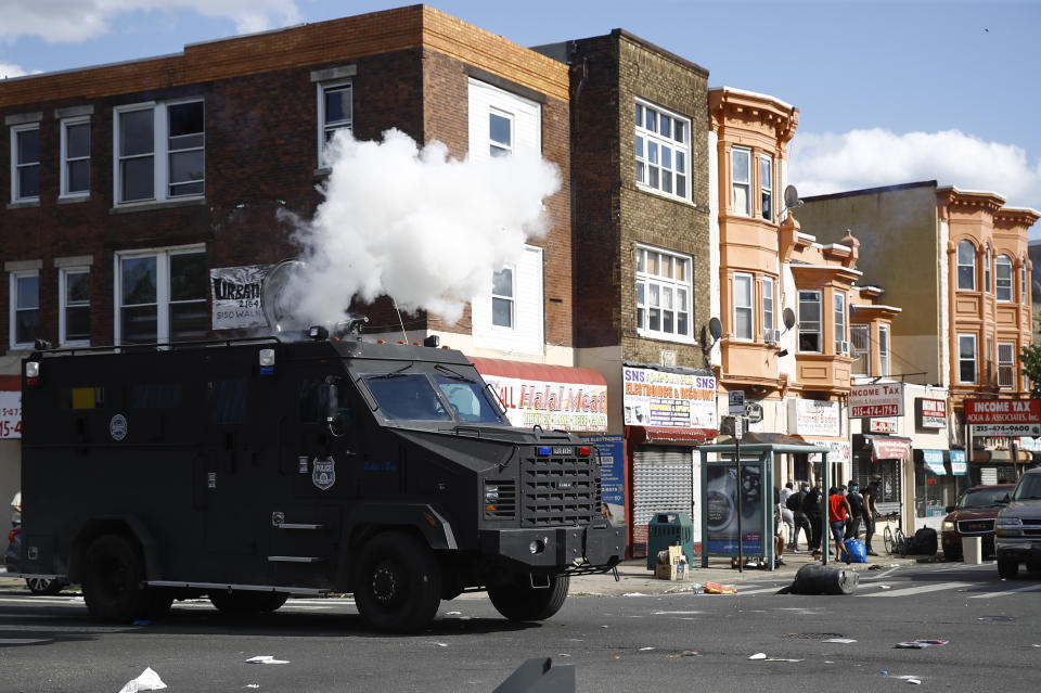 FILE - In this May 31, 2020 file photo, police deploy tear gas to disperse a crowd during a protest in Philadelphia over the death of George Floyd. Floyd died May 25 after he was pinned at the neck by a Minneapolis police officer. Three class-action lawsuits filed in Philadelphia on Tuesday, July 14, accuse the city of using military-level force against peaceful demonstrators protesting racial inequality and police brutality. (AP Photo/Matt Rourke, File)