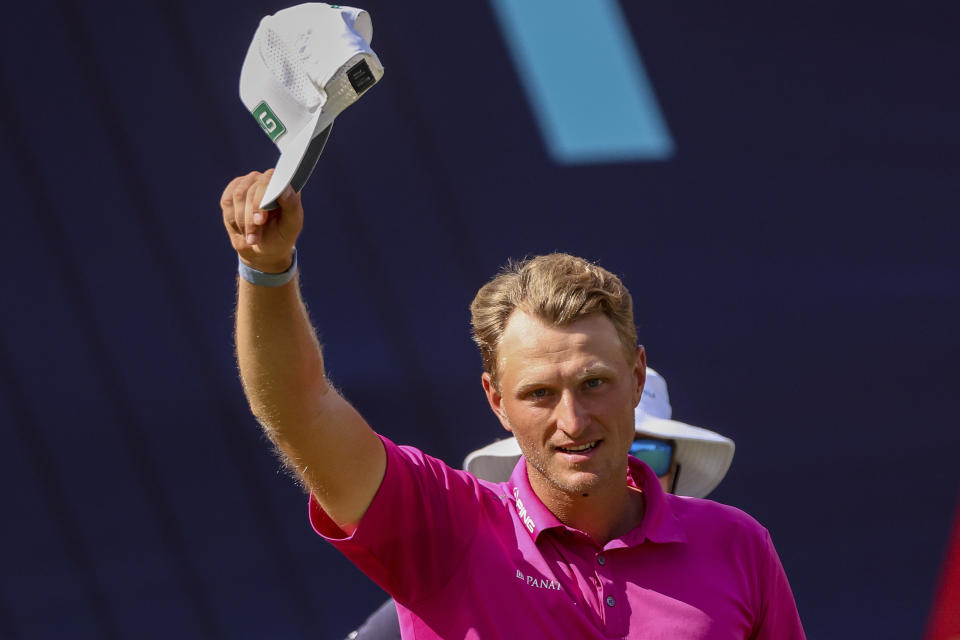 Poland's Adrian Meronk celebrates on the 18th hole after winning the Australian Open golf championship at Victoria golf course in Melbourne, Australia, Sunday, Dec. 4, 2022. (AP Photo/Asanka Brendon Ratnayake)