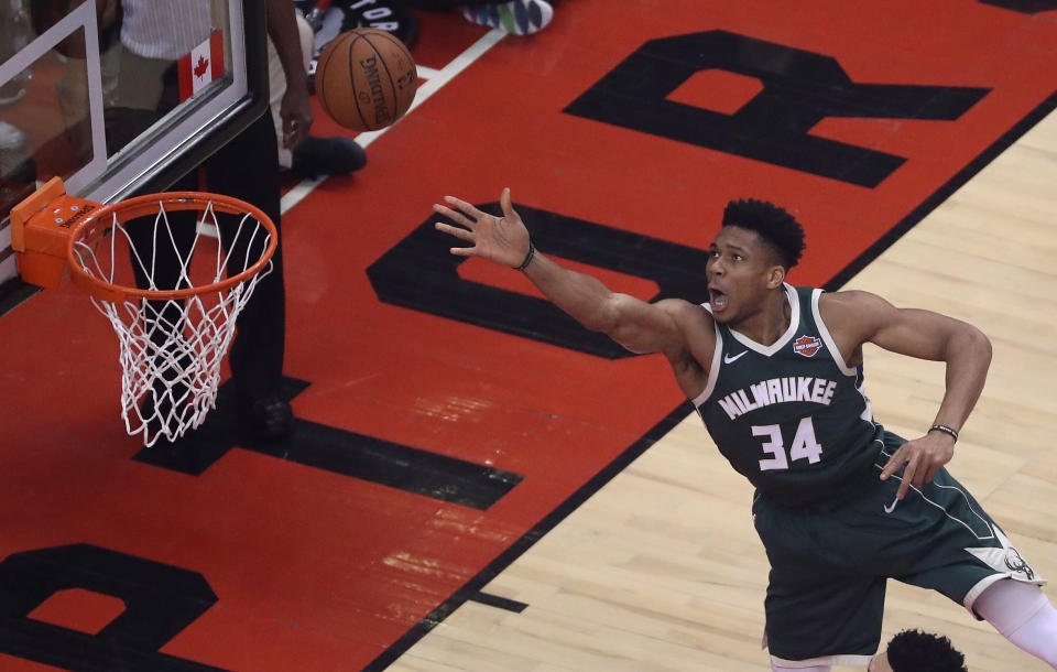 Milwaukee Bucks forward Giannis Antetokounmpo puts up a shot as the  Toronto Raptors beat the Milwaukee Bucks 118-112 in double overtime in the Eastern Conference finals at Scotiabank Arena in Toronto.