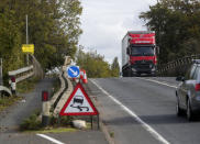 A police witness appeal sign on the A40 near Oxford where a four-year-old girl, a six-year-old boy, an eight-year-old girl and a 29-year-old woman from Chinnor, Oxfordshire, died Monday night after a collision between a people carrier and a heavy goods vehicle.