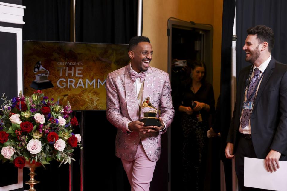 J. Ivy holds his trophy