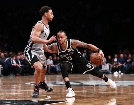 Feb 25, 2019; Brooklyn, NY, USA; Brooklyn Nets guard Shabazz Napier (13) drives to the basket against San Antonio Spurs guard Bryn Forbes (11) in the fourth quarter at Barclays Center. Mandatory Credit: Nicole Sweet-USA TODAY Sports