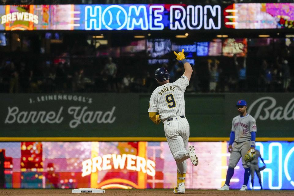 Milwaukee Brewers' Jake Bauers celebrates his home run during the seventh inning of Game 3 of a National League wild-card baseball game against the New York Mets on Thursday, Oct. 3, 2024, in Milwaukee. (AP Photo/Morry Gash)