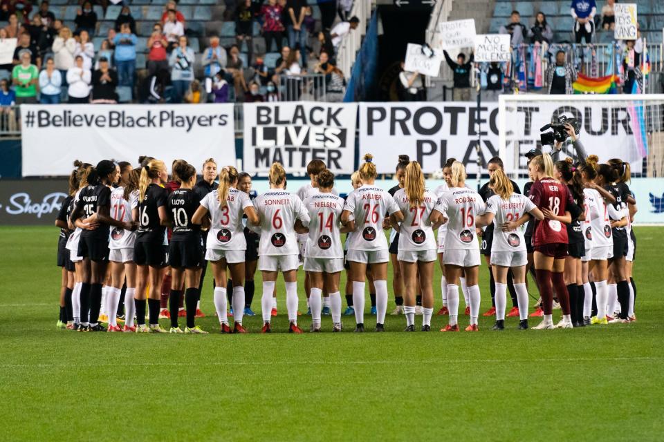 Players stop the match during the first half of a NWSL soccer match between NJ/NY Gotham FC and the Washington Spirit in a protest at Subaru Park.