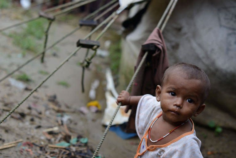 A Muslim Rohingya child stands outside his tent at the Say Thamagyi Internally Displaced Persons (IDP) camp, located on the outskirts of Sittwe in October 2012. The United Nations' humanitarian chief Valerie Amos said almost half a million people are displaced "in need of assistance" in Myanmar