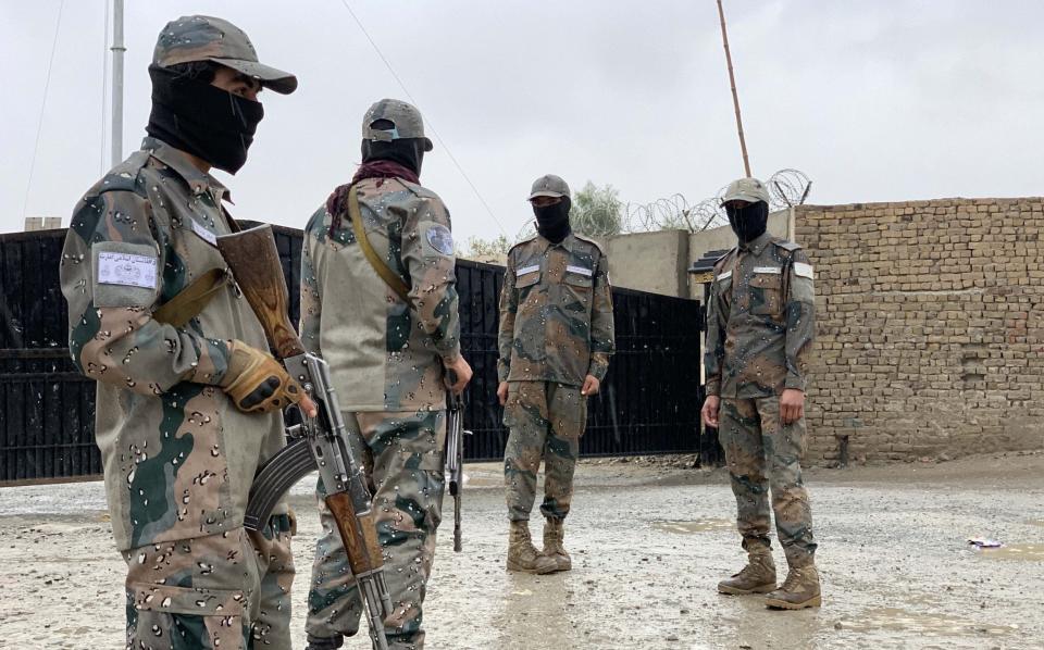 Afghan security officials stand guard - STRINGER/EPA-EFE/Shutterstock