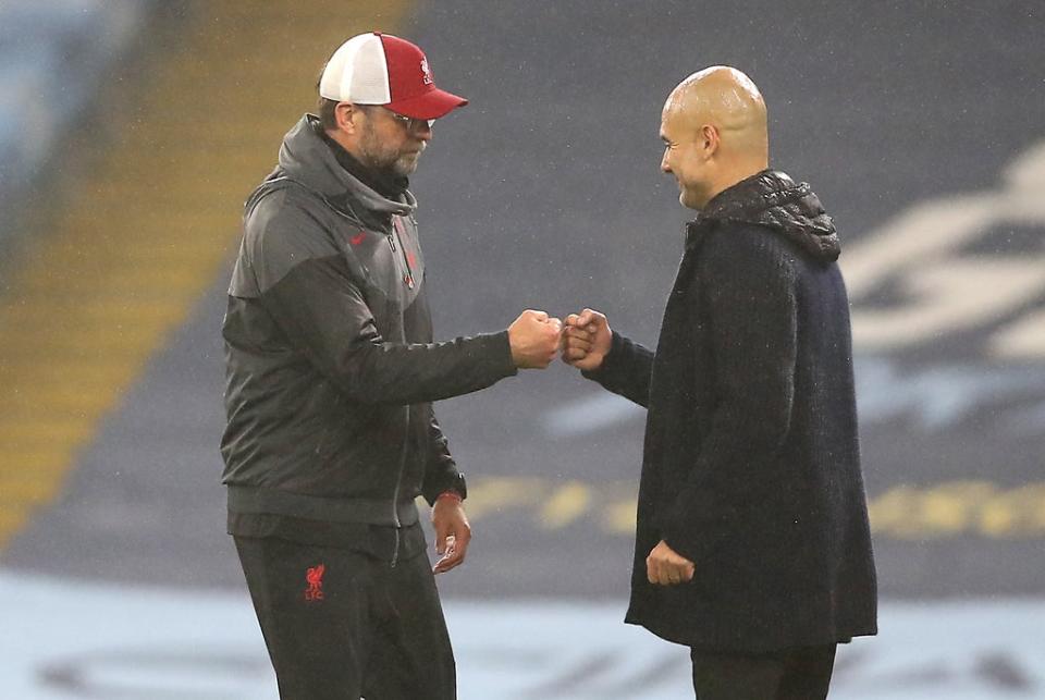 Jurgen Klopp and Pep Guardiola (right) see their sides go head to head in a title showdown (Martin Rickett/PA) (PA Archive)