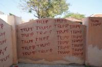 A wall covered with the word Trump is pictured where Bussa Krishna, a fan of US President Donald Trump, has installed a statue of Trump at his house in Konney village in Warangal district in the southern state of Telangana