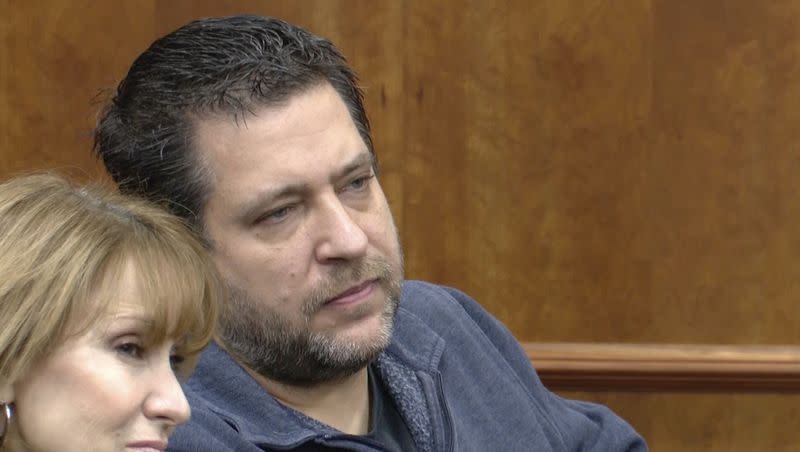 This image taken from video provided by WTVG shows the Rev. Chris Avell, pastor of Dad’s Place, sitting inside Bryan Municipal Court on Thursday, Jan. 11, 2024, in Bryan, Ohio. The Christian church filed a federal lawsuit Monday, Jan. 22, after being charged with violating the zoning laws in the northwestern Ohio city by opening up the church around-the-clock for homeless residents and others to find shelter.