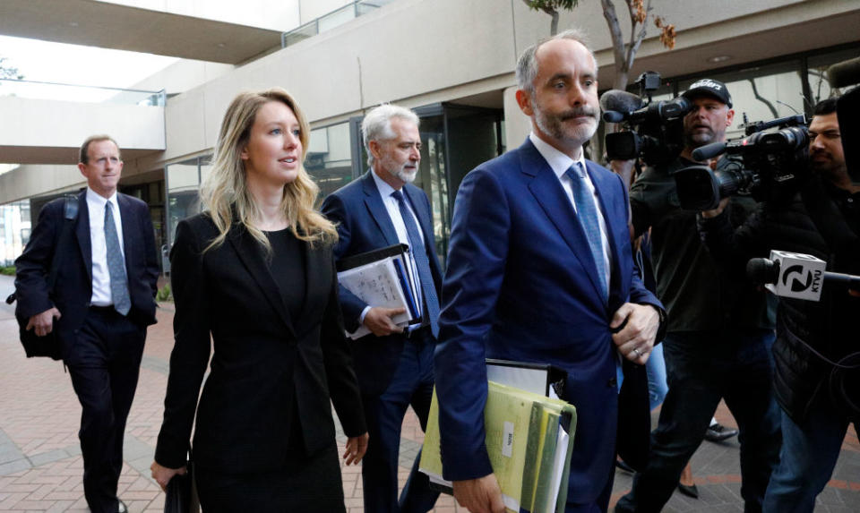 Former Theranos CEO Elizabeth Holmes and lawyer Kevin Downey leave a federal court after a status hearing on July 17, 2019 in San Jose, California.<span class="copyright">Kimberly White—Getty Images</span>