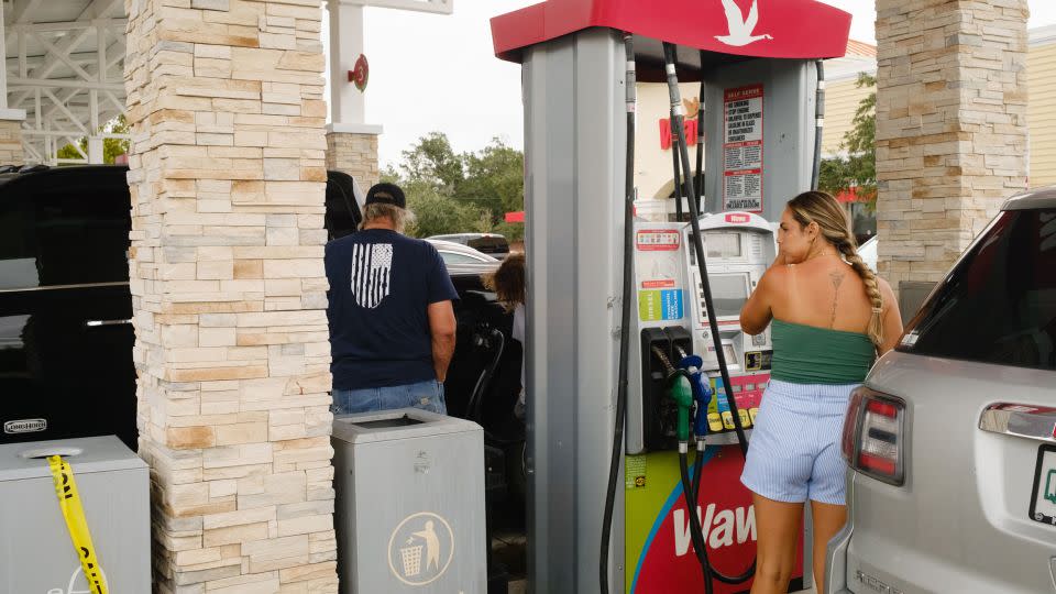 Residents purchase fuel at a St. Petersburg, Florida, gas station ahead of Hurricane Milton's expected landfall on Monday, October 7. - Tristan Wheelock/Bloomberg/Getty Images