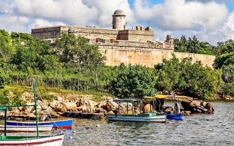 Jagua castle with lake and boats in front - Credit: iStock