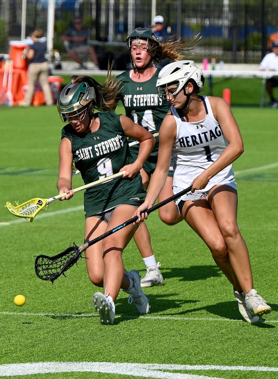 American Heritage-Delray Victoria Tomonto (1) fight for to secure the ball during their with Saint Stephen’s Episcopal in a girls 1A lacrosse semifinal matchup in Naples, Fla., Thursday, May 4, 2023.