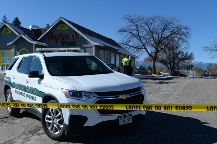 A Colorado Springs community service vehicle is parked near a gay nightclub in Colorado Springs, Colo., Sunday, Nov. 20, 2022, where a shooting occurred late Saturday night. Police say a 22-year-old gunman opened fire at the gay nightclub, Club Q, killing several people and leaving multiple people injured before he was subdued by “heroic” patrons. (AP Photo/Geneva Heffernan)