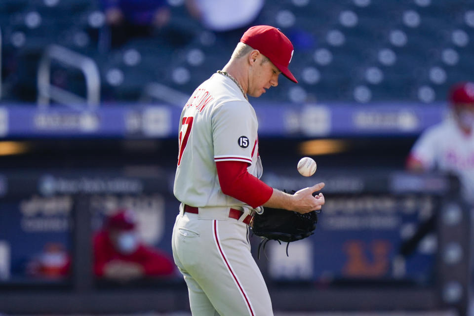 Philadelphia Phillies starting pitcher Chase Anderson reacts after New York Mets' Dominic Smith hit a two-run home run during the first inning of a baseball game in the first game of a doubleheader Tuesday, April 13, 2021, in New York. (AP Photo/Frank Franklin II)