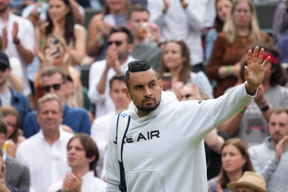 Australia's Nick Kyrgios leaves the court after retiring from the men's singles third round match against Canada's Felix Auger-Aliassime on day six of the Wimbledon Tennis Championships in London, Saturday July 3, 2021. (AP Photo/Alberto Pezzali)