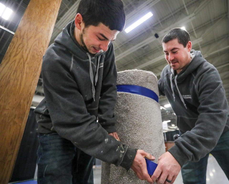 Marcus, left, and Nate Lech prepare for the 60th NARI Home Improvement Show that takes place this weekend at the Wisconsin Exposition Center at State Fair Park, 8200 W. Greenfield Ave., in West Allis.