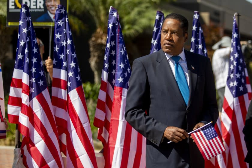 LOS ANGELES, CA - SEPTEMBER 13: Gubernatorial recall candidate Larry Elder will present a medal to a Chinese-American World War II veteran at the Monterey Park City Hall on Monday, Sept. 13, 2021 in Los Angeles, CA. Tomorrow is the election. (Francine Orr / Los Angeles Times)