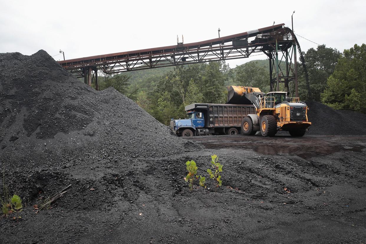 A truck is loaded with coal at a mine on August 26, 2019 near Cumberland, Kentucky. Eastern Kentucky, once littered with coal mines, is seeing that lifeblood rapidly slip away.