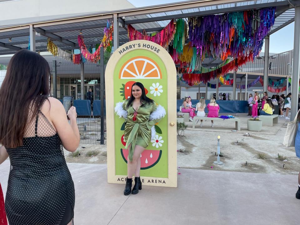 Liz Figueroa of Moreno Valley takes a photo in front of “Harry’s House” decor outside Acrisure Arena ahead of the Harry Styles concert in Palm Desert, Calif. Wednesday, Feb. 1, 2023.