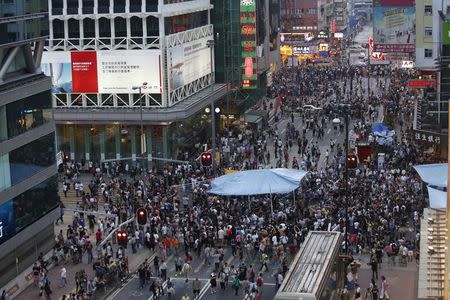 Pro-democracy protesters block a main junction at Hong Kong's shopping Mongkok district October 4, 2014. REUTERS/Bobby Yip