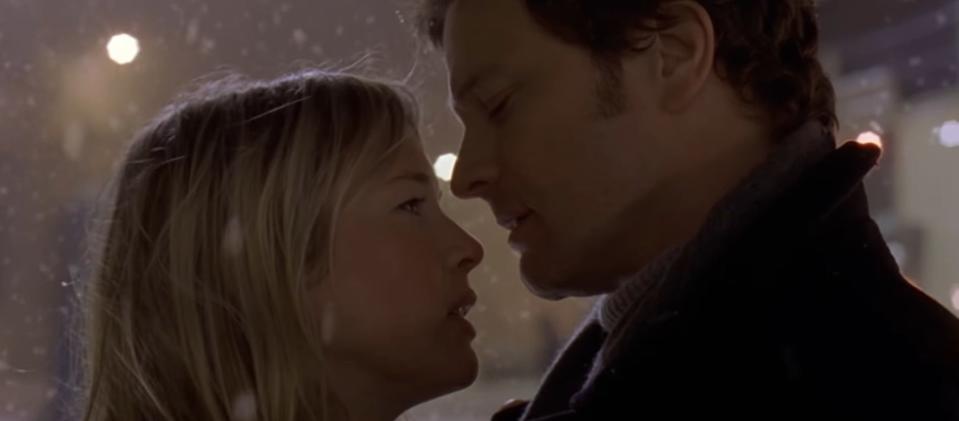 Bridget standing with Mark in the snow in "Bridget Jones's Diary"