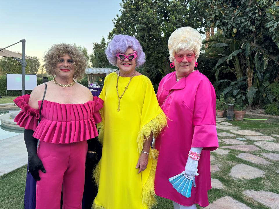Host Richard Odell (center) poses with Chrissy Capri and Miami Barbi at Drag Me to Giving Under the Stars on Oct. 7, 2023.