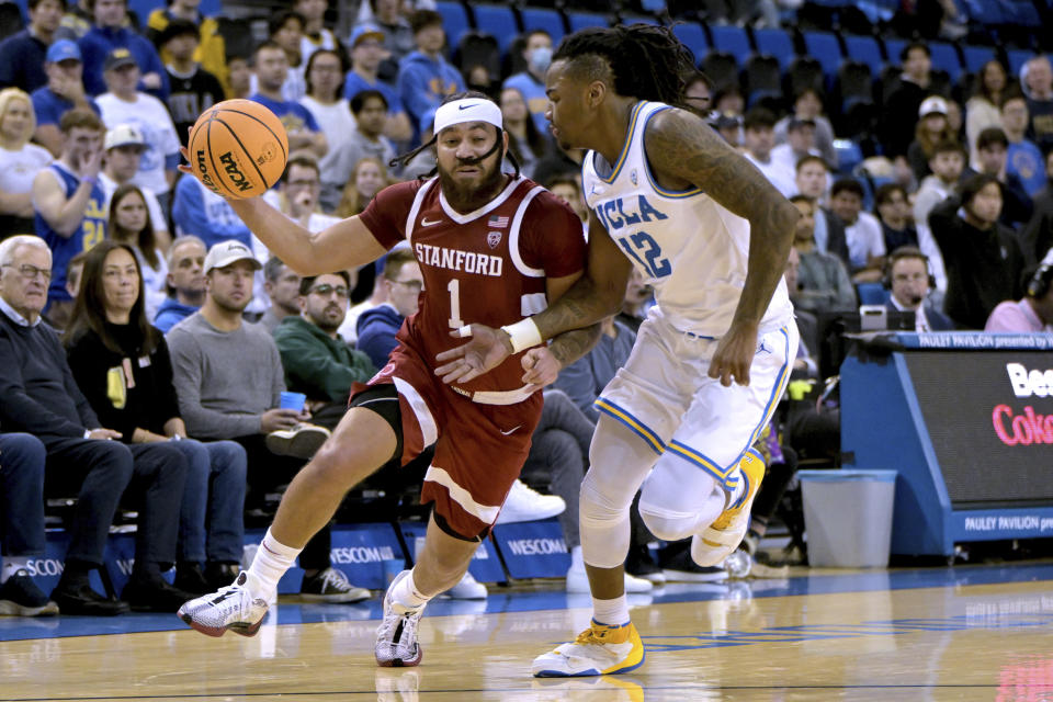 Stanford guard Jared Bynum, left, is defended by UCLA guard Sebastian Mack during the first half of an NCAA college basketball game Wednesday, Jan. 3, 2024, in Los Angeles. (AP Photo/Jayne Kamin-Oncea)