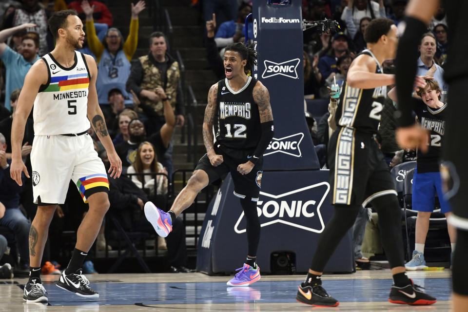 Memphis Grizzlies guard Ja Morant (12) reacts in the second half of an NBA basketball game against the Minnesota Timberwolves, Friday, Feb. 10, 2023, in Memphis, Tenn. (AP Photo/Brandon Dill)
