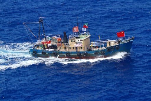 This picture taken by Japan Coast Guard shows a Hong Kong boat near disputed islands in the East China Sea. Japan has made 14 arrests after pro-China activists landed on an island at the centre of a bitter territorial dispute, in an episode that threatens to further destabilise fractious relations