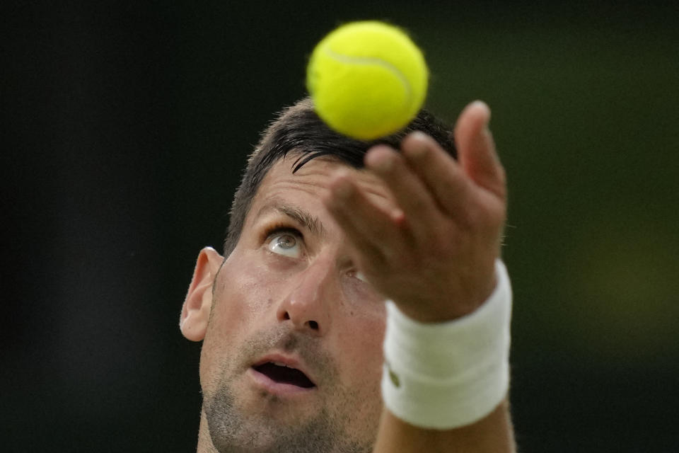 FILE - Serbia's Novak Djokovic serves to Tim van Rijthoven of the Netherlands during a men's fourth round singles match on day seven of the Wimbledon tennis championships in London, Sunday, July 3, 2022. Djokovic's bid for Wimbledon title No. 8 and Grand Slam trophy No. 24 starts next week. (AP Photo/Kirsty Wigglesworth, File)